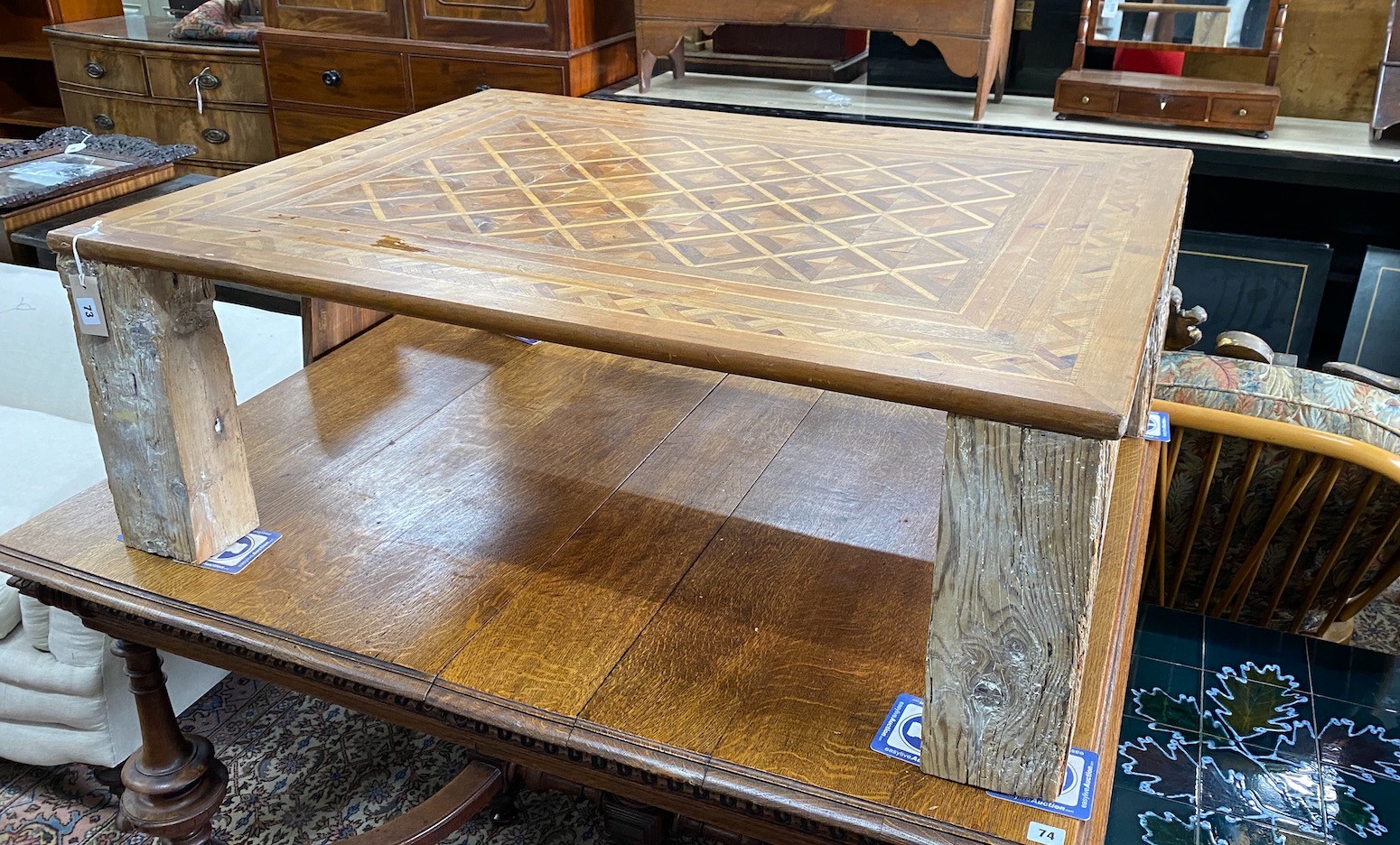 A rectangular parquetry coffee table, width 115cm, depth 89cm, height 40cm